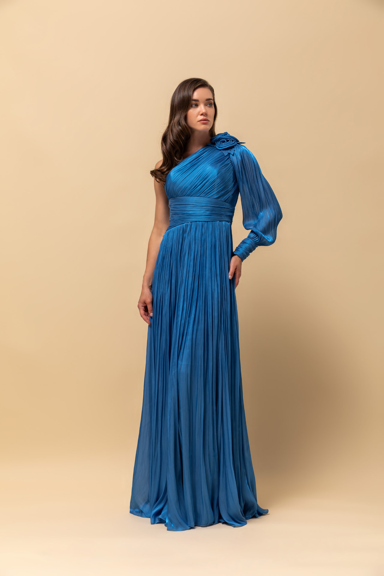 Azure pleated chiffon one-shoulder gown with rosette and billowing sleeve