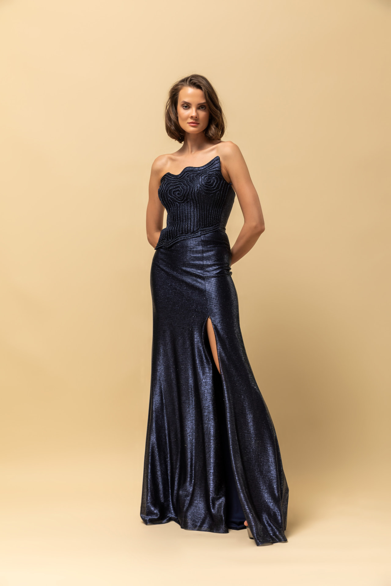 Navy metallic strapless gown with corded rose bodice and thigh slit