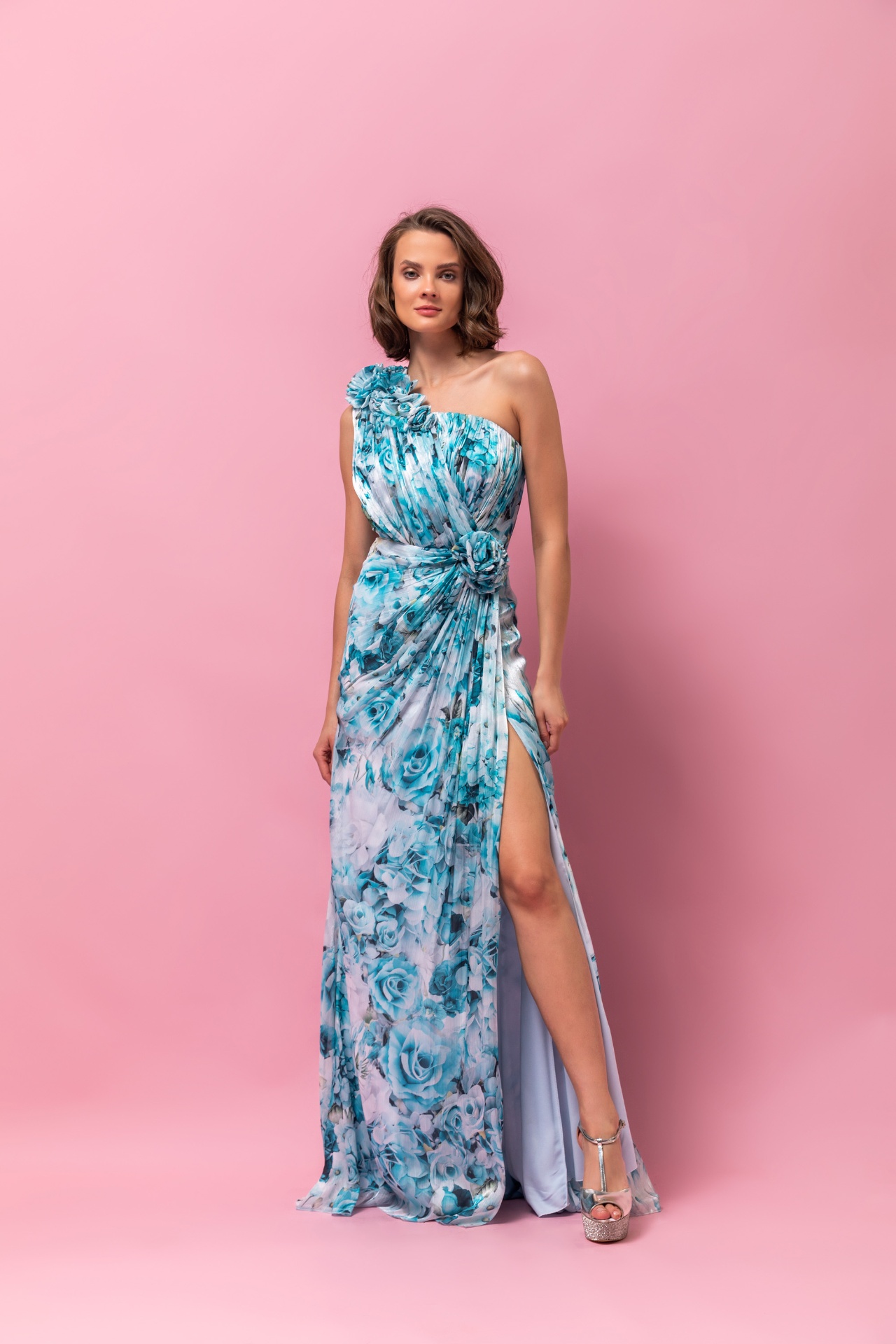 Aqua rose print one-shoulder chiffon gown with floral shoulder detail and high slit
