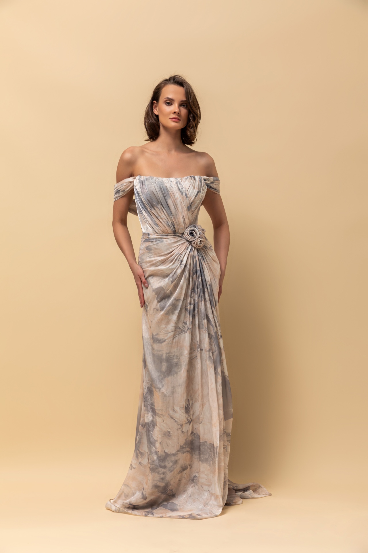 Off-shoulder floral print chiffon gown with rosette waist detail