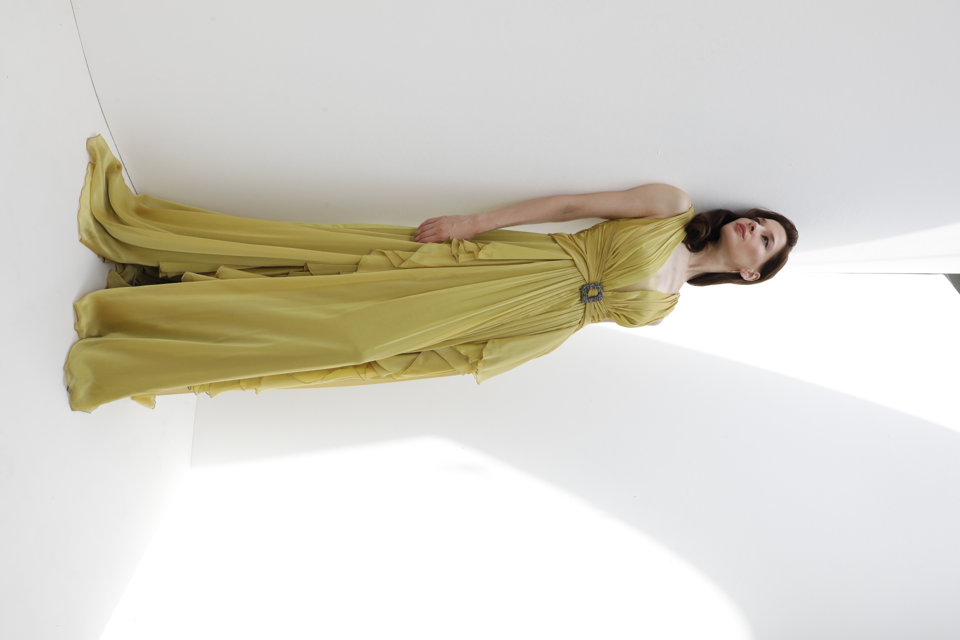 Chartreuse chiffon V-neck gown with crystal buckle and cascade ruffle
