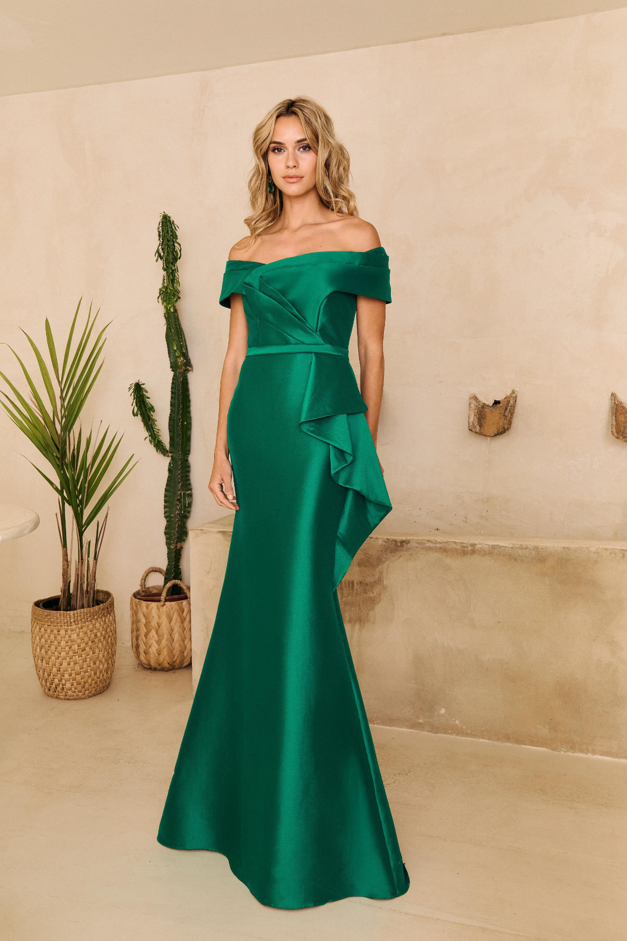 Emerald green off-shoulder satin mermaid gown with side ruffle drape